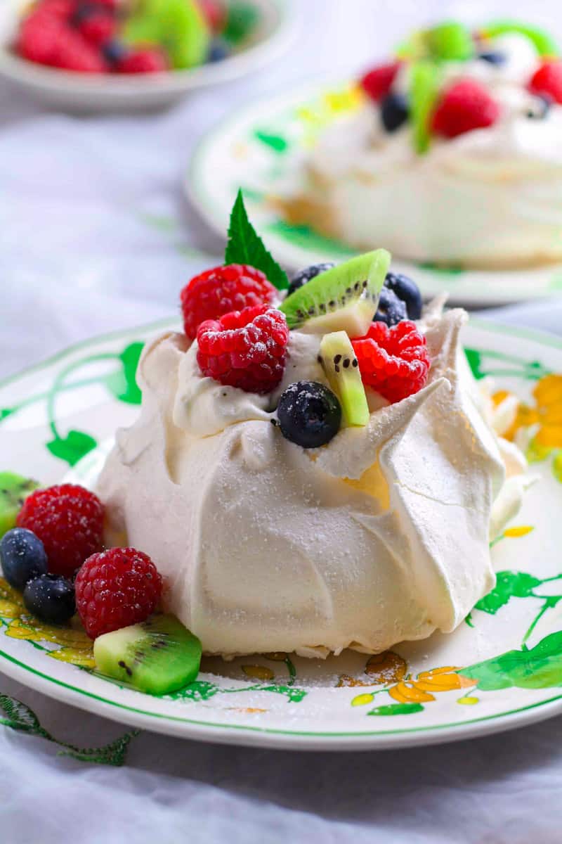 Mini Pavlovas with berries and kiwi.