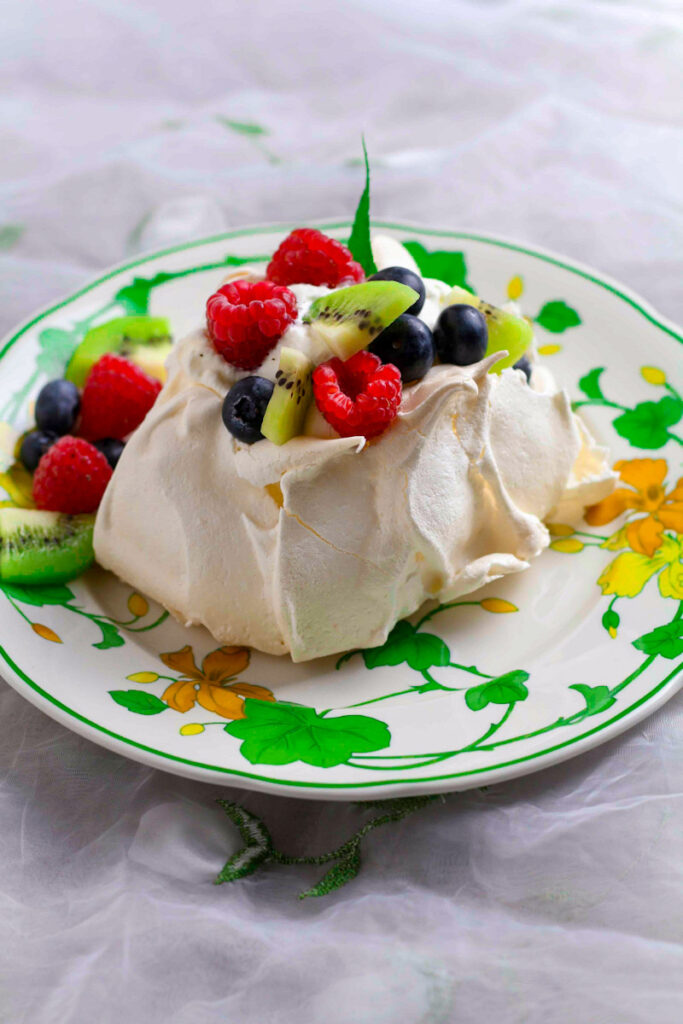 Mini Berry Pavlova with fresh berries.