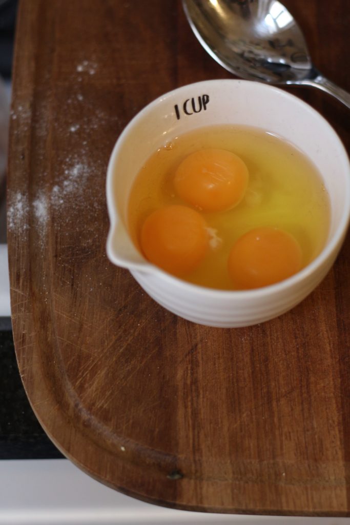 Eggs in a measuring cup.