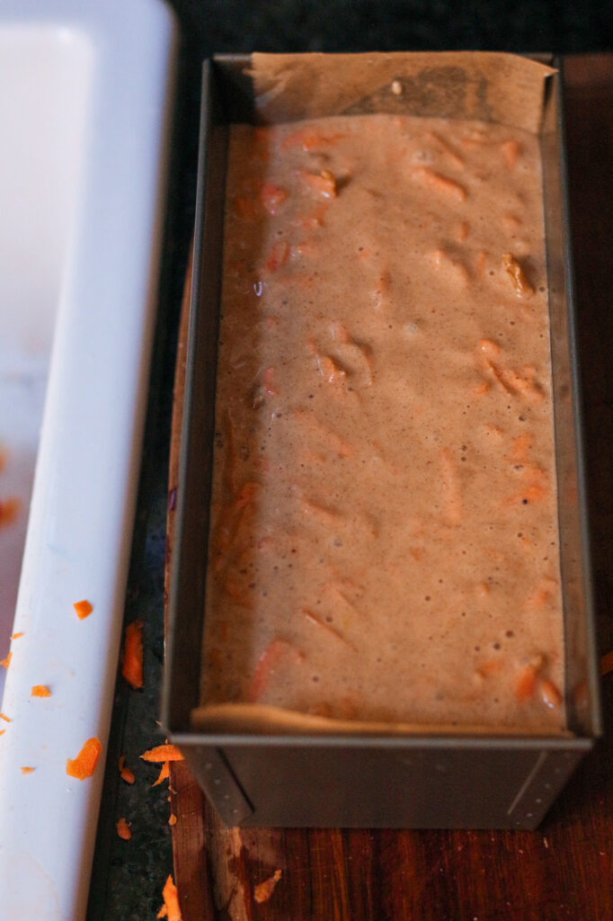 Unbaked Carrot Cake loaf in a loaf pan.