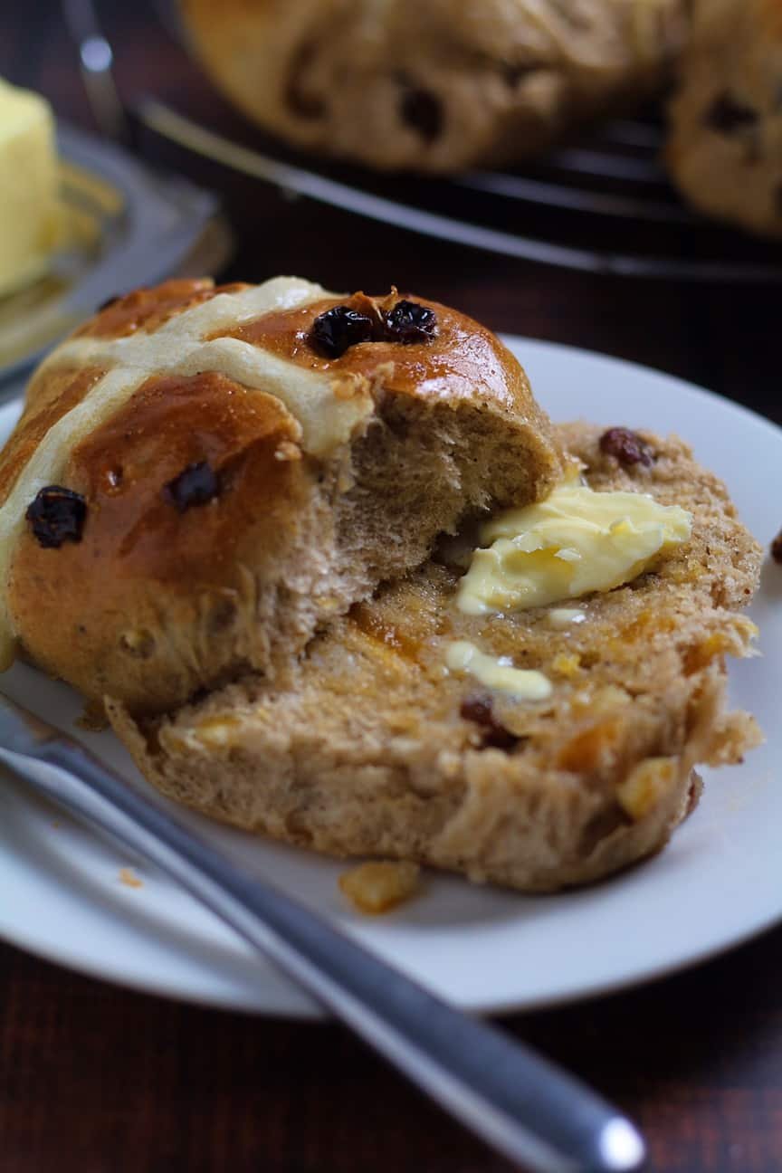 Fruity Hot Cross Buns slices and slathered with melting butter.