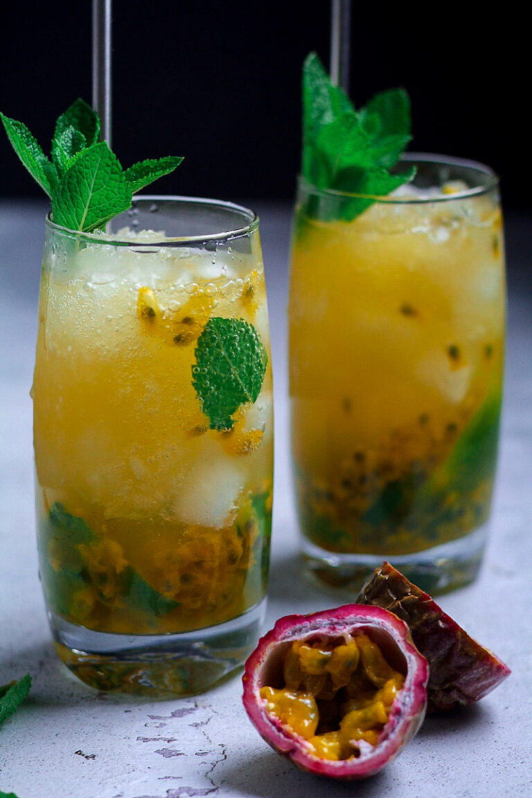 Passion fruit mojito cocktails with lime and mint garnish. "Passion Fruit Lime Mojito" text overlay.