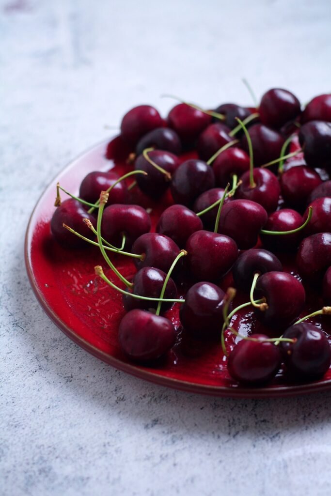 Cherries on a red plate
