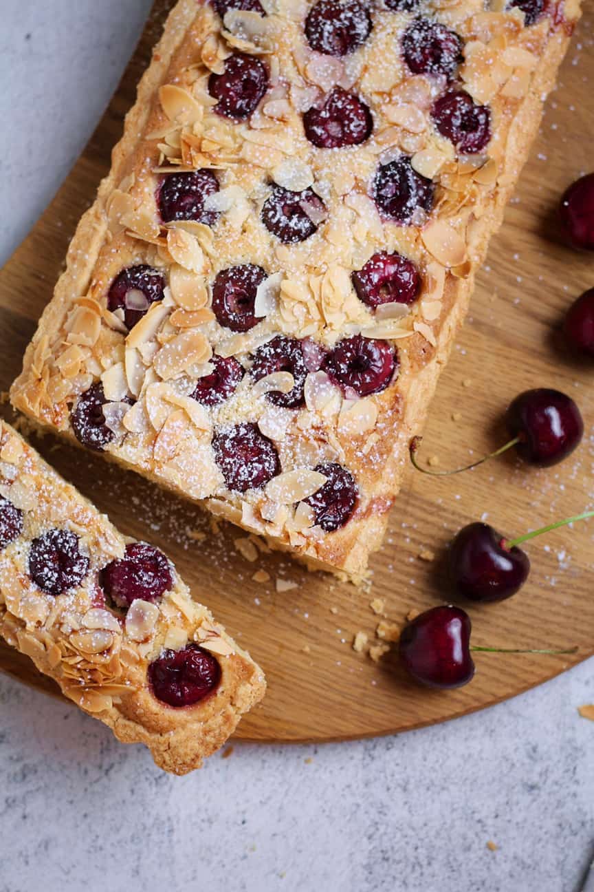 Cherry Almond Frangipane Tart on a wooden board.