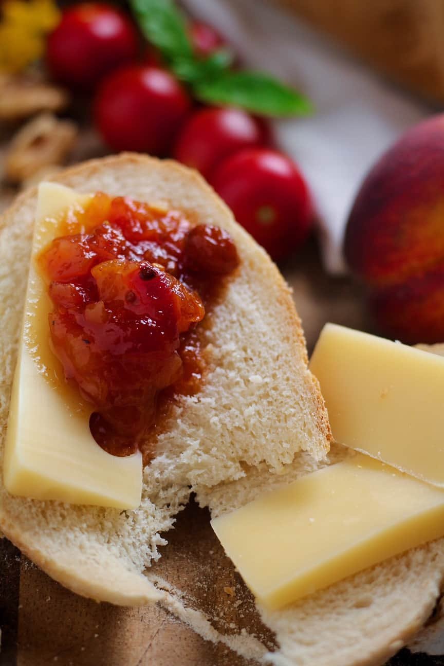Peach and Tomato Chutney on a piece of baguette with sliced cheese