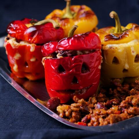 Jack o lantern peppers stuffed with chili beef.