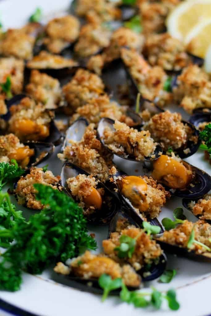 Garlic Butter Mussels au gratin or as the Italians call them Cozze al Forno are a fantastic starter or light meal for two. So quick and easy to prepare they are packed with Mediterranean flavour.