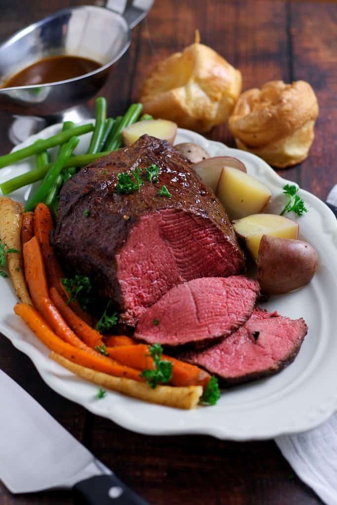 Perfectly tender, rosy roast beef is easier than you think! Slow Roast Beef where the beef is seared before roasting at a very low temperature produces juicy, delicious beef every time.