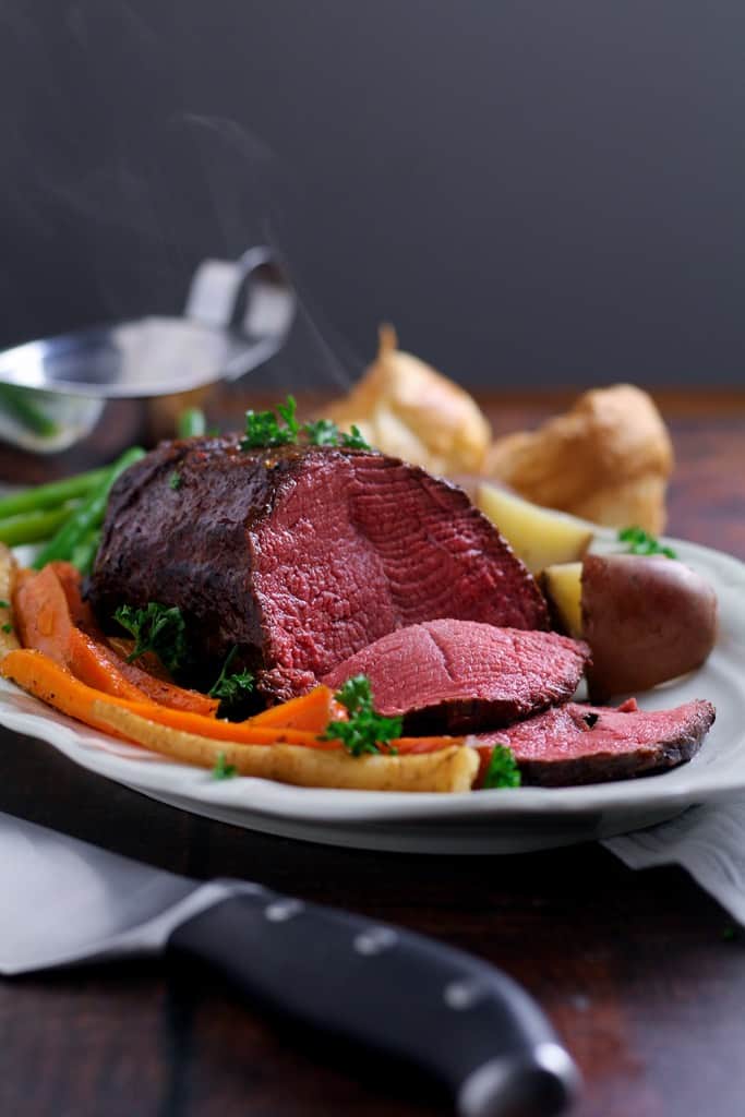 Perfectly tender, rosy roast beef is easier than you think! Slow Roast Beef where the beef is seared before roasting at a very low temperature produces juicy, delicious beef every time.