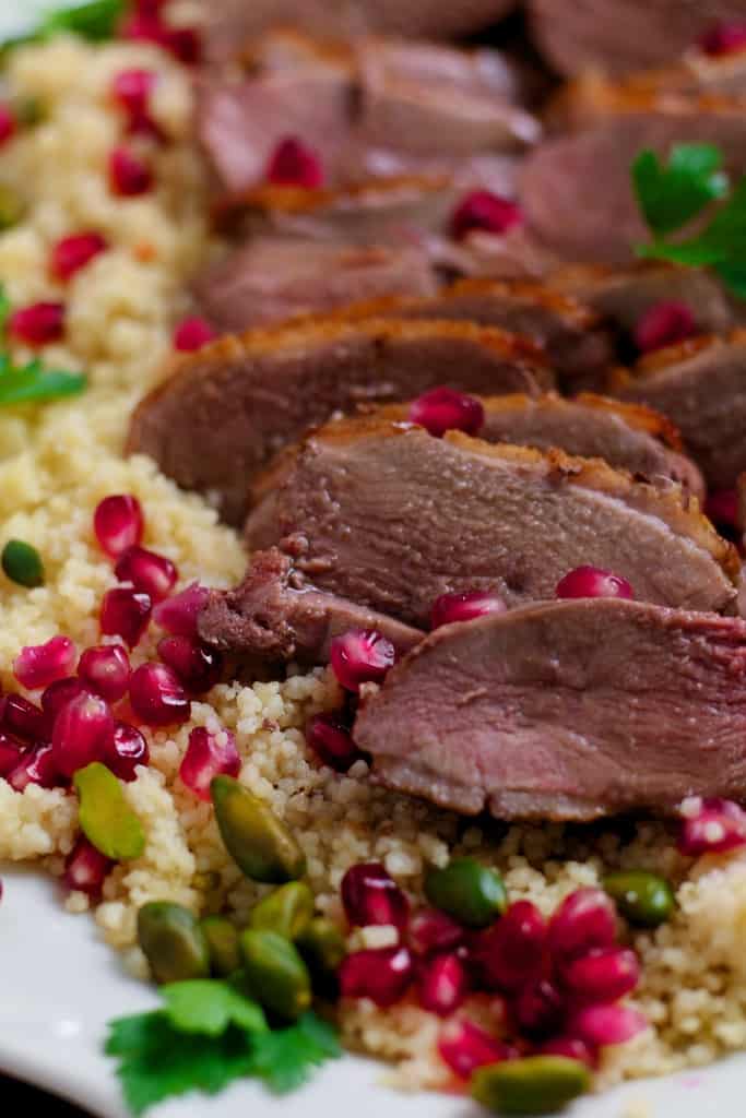 Juicy duck breast served with a sweet and sour pomegranate sauce. Seared Duck with Pomegranate is a delicious meal for two or perfect for a dinner party. Serve with jewelled couscous for a showstopper dinner.