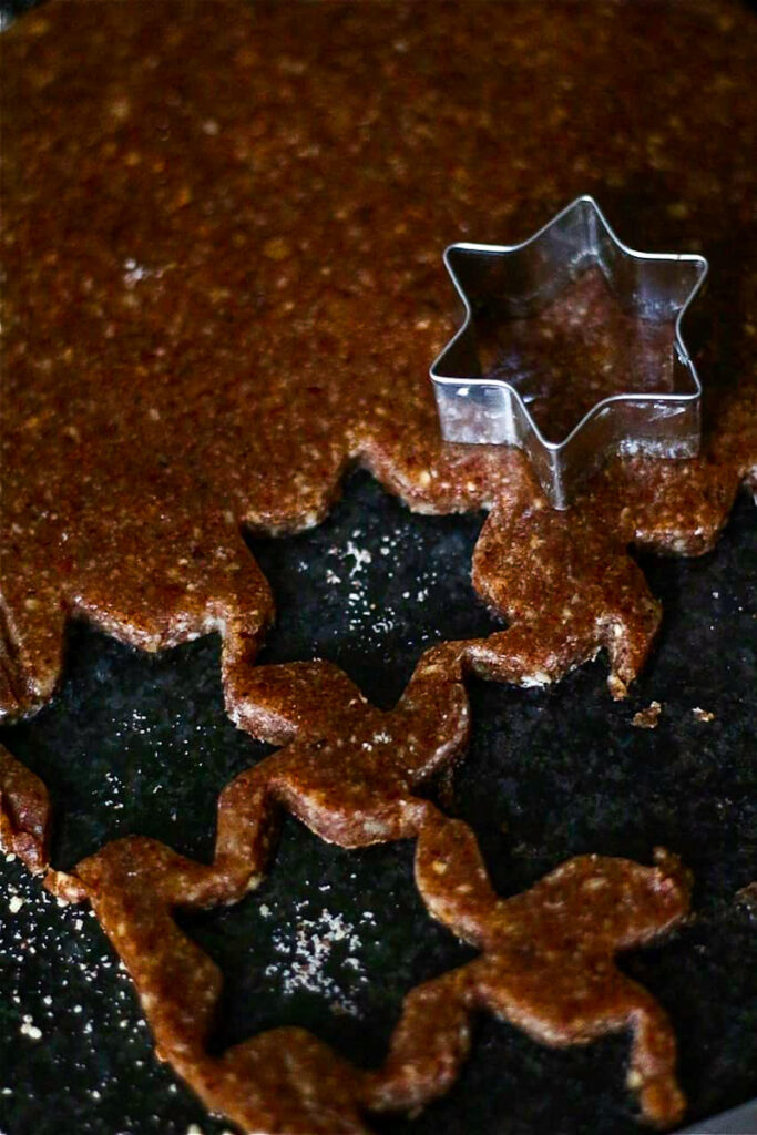 Cinnamon Stars being cut out of cookie dough.