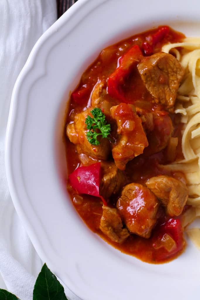 If you’ve ever travelled to Hungary you are sure to have eaten plenty of this famous dish. Similar to goulash, Hungarian Pork Stew or Pörkölt is thick and hearty with a rich tomatoey sauce, perfect as a winter warmer.