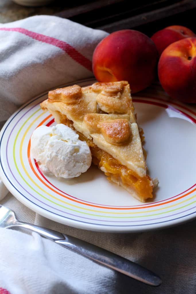 Peach and Ginger Pie is the perfect bake for those long, lazy, late summer days when the trees are full of ripe, juicy fruit. Perfect for taking on a picnic, or serving for dessert. I like to get started with making the pastry as soon as I get up, while the kitchen is still cool.