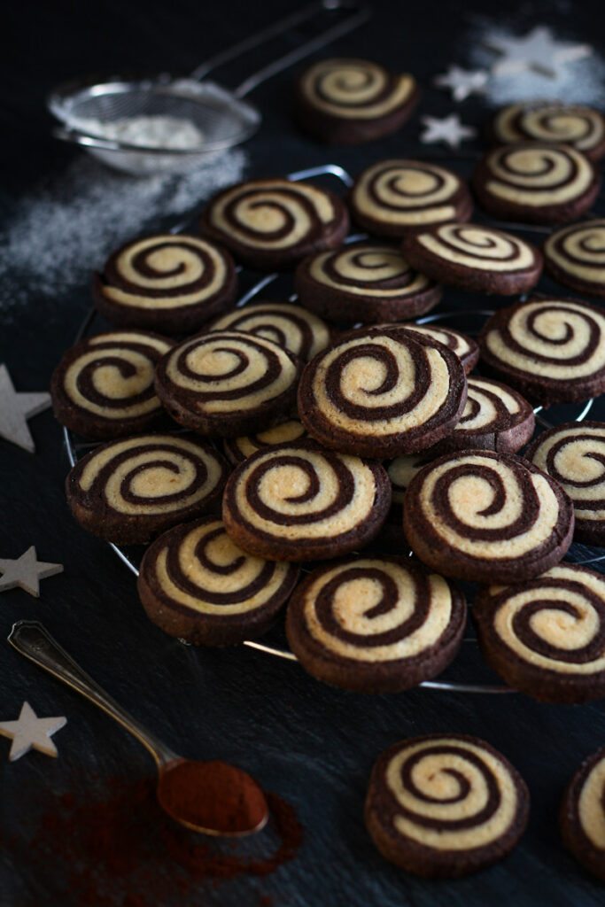 Chocolate Pinwheel Christmas Cookies on a cooling rack.