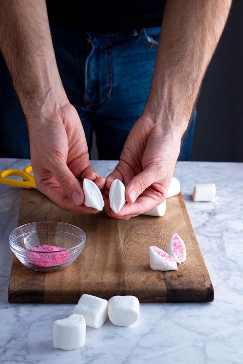 Jay Wadams Cutting marshmallows for Easter Bunny Cupcakes and showing the cut side.