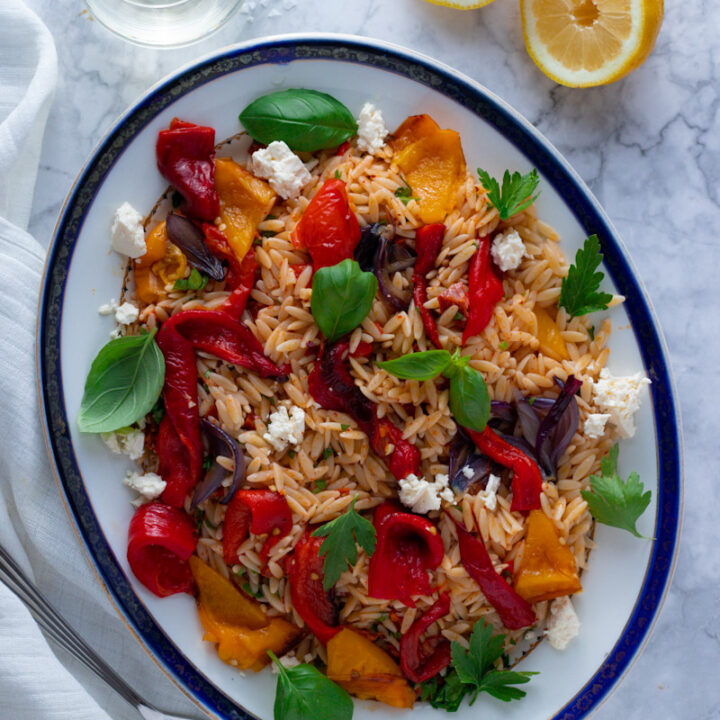 Packed with roasted peppers, tangy feta, fresh herbs and chewy orzo, this bright and beautiful pasta salad is a summer favourite. Orzo and Roast Pepper Salad gets better as the days go by, so make a big batch to take you through the week!