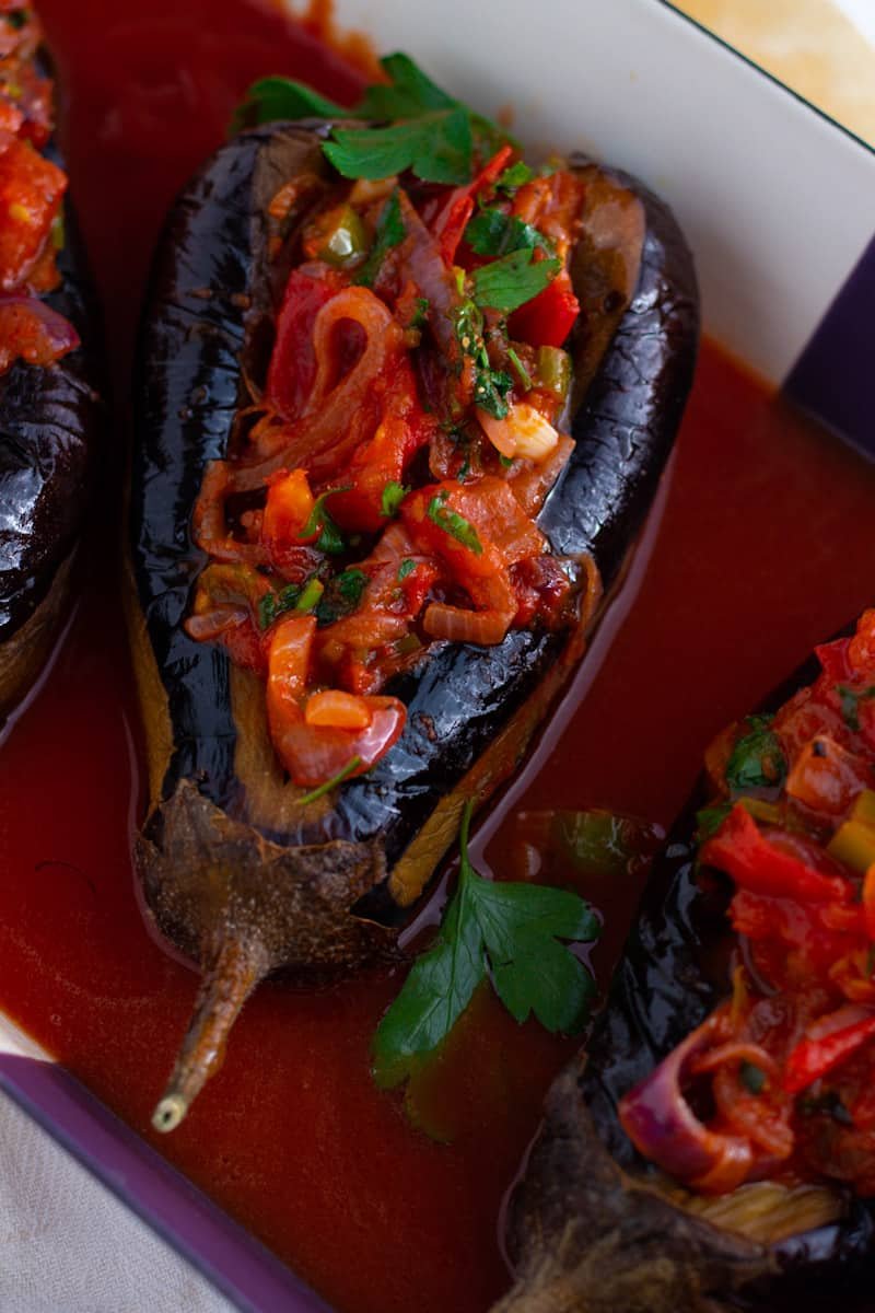 A picture of Imam Bayildi, roast Turkish eggplants stuffed with tomatoes and onions 