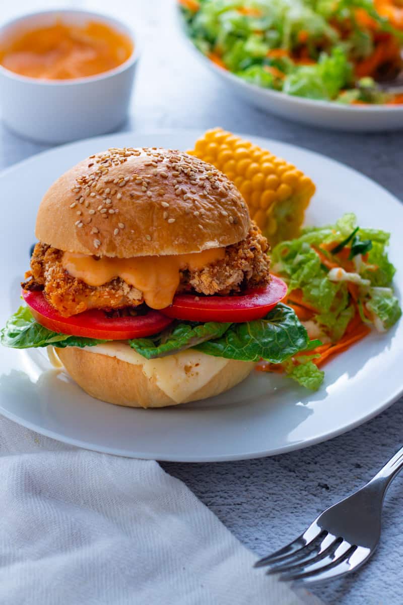 Spicy Crumbed Chicken Burgers serves with homemade coleslaw and fresh corn