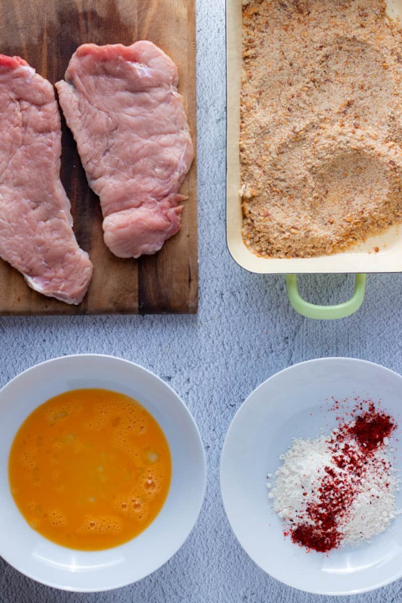 Pork, bread crumbs, eggs and flour for schnitzels