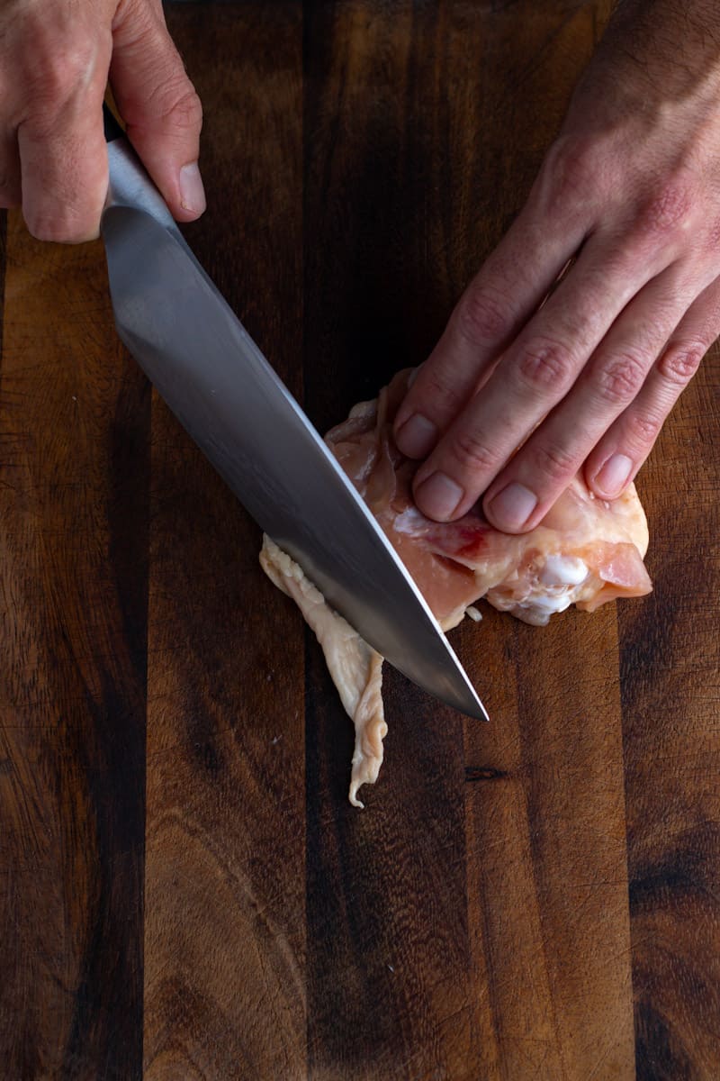 cut skin away from chicken thigh