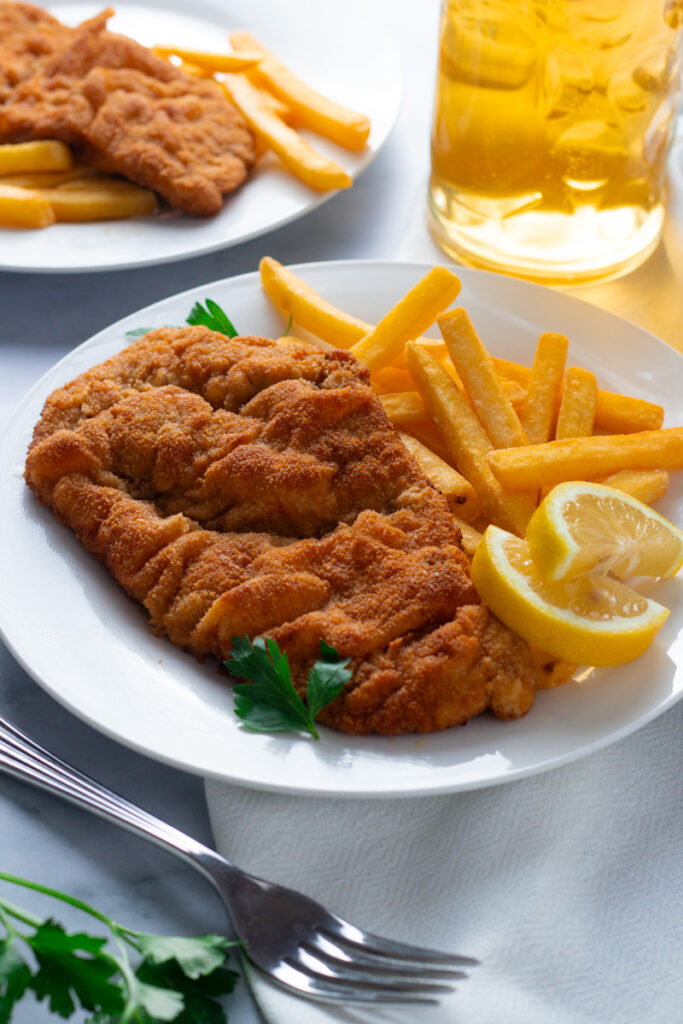 Bavarian Pork Schnitzel on a plate with fries