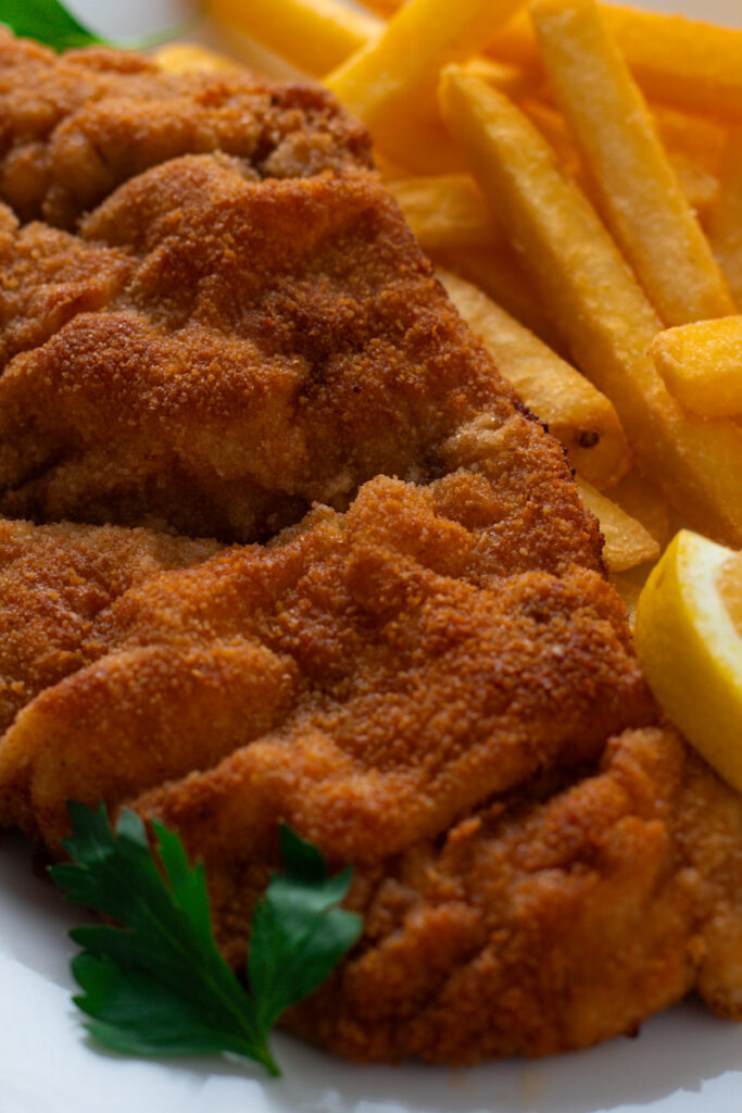 Bavarian Pork Schnitzel on a plate with fries