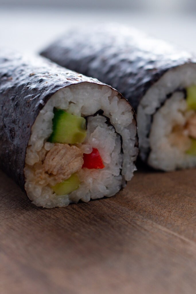 Sliced chicken sushi rolls.