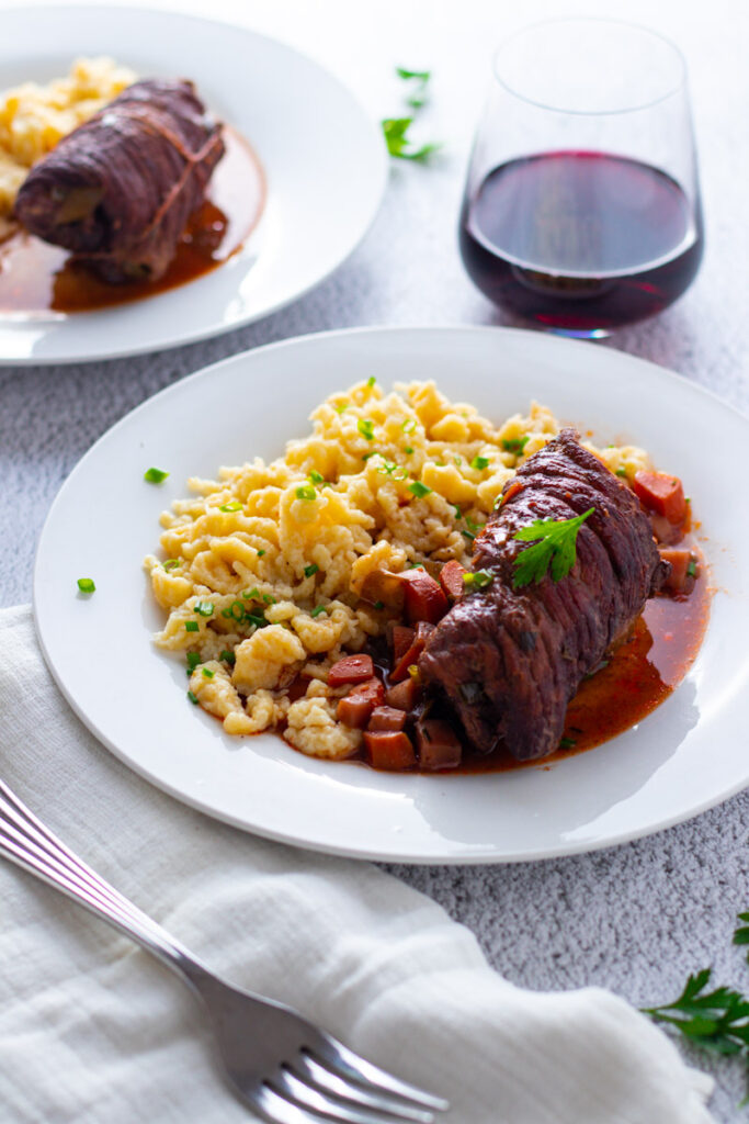 German beef rouladen with spaetzle and red wine.