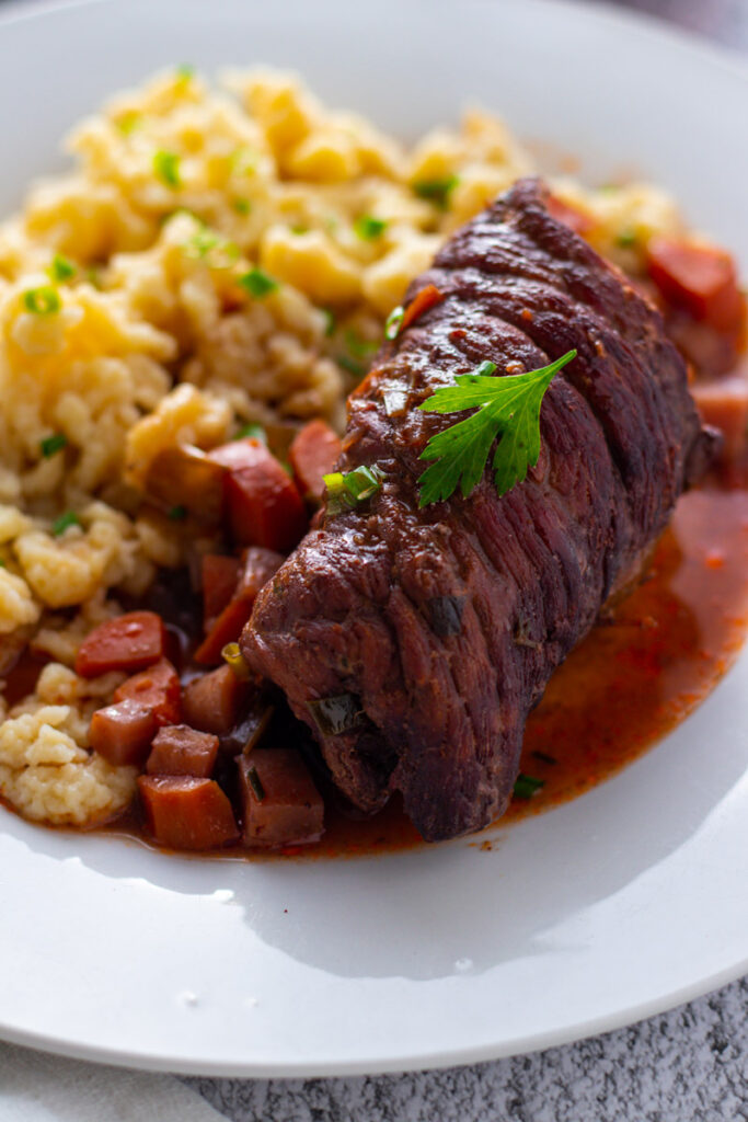 German beef rouladen with spaetzle and red wine.