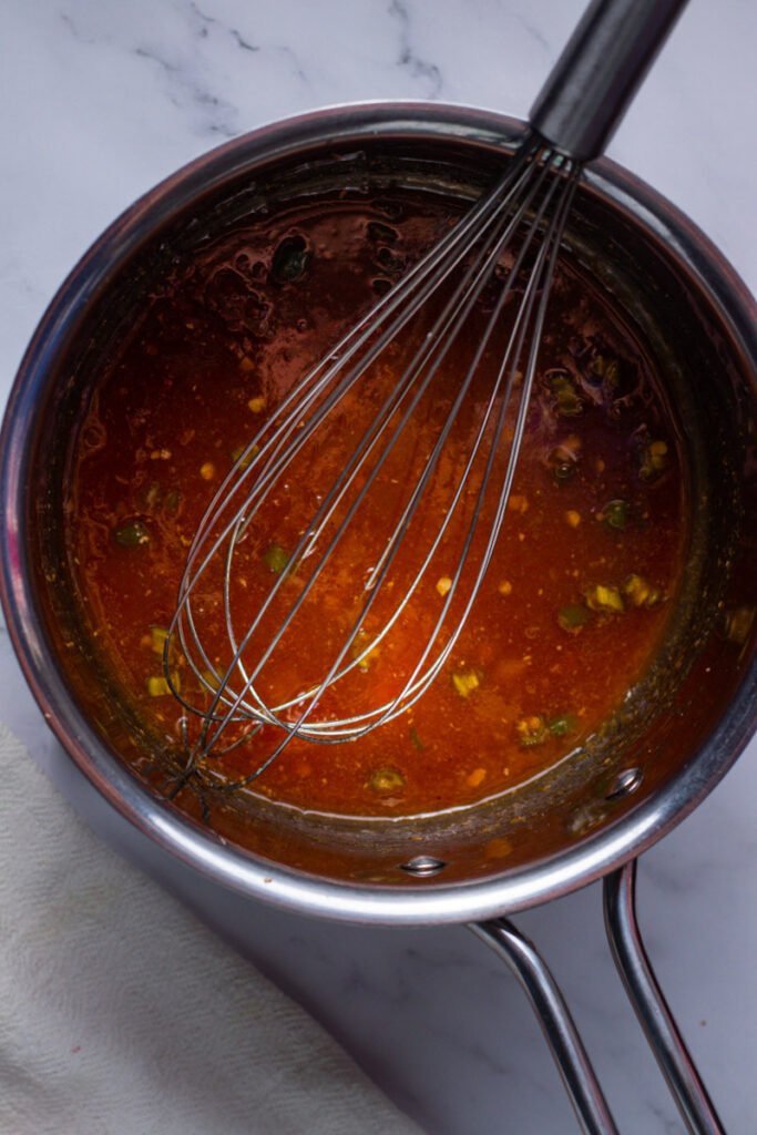 Apricot glaze in a saucepan.