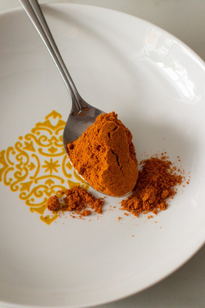 Curry powder on a spoon.
