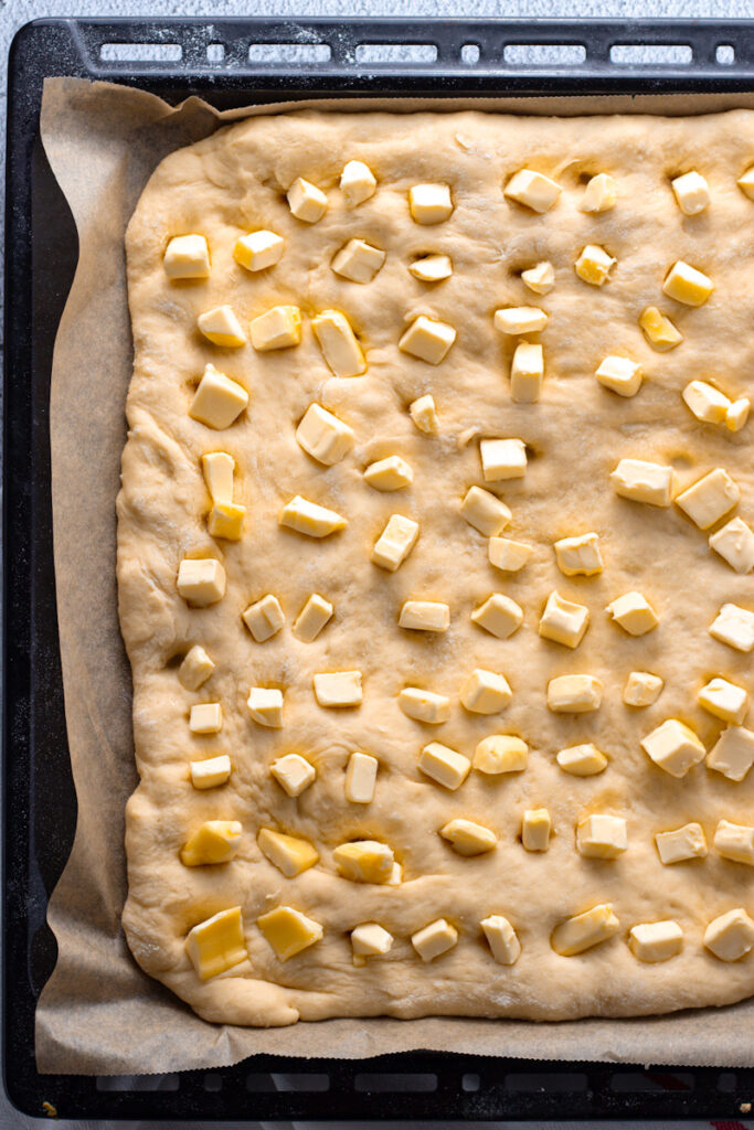 Butter on butterkuchen dough.