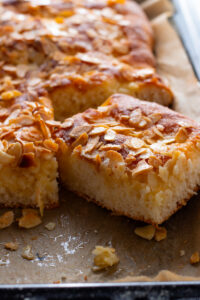 German Butter cake or Butterkuchen with a slice cut to show interior.