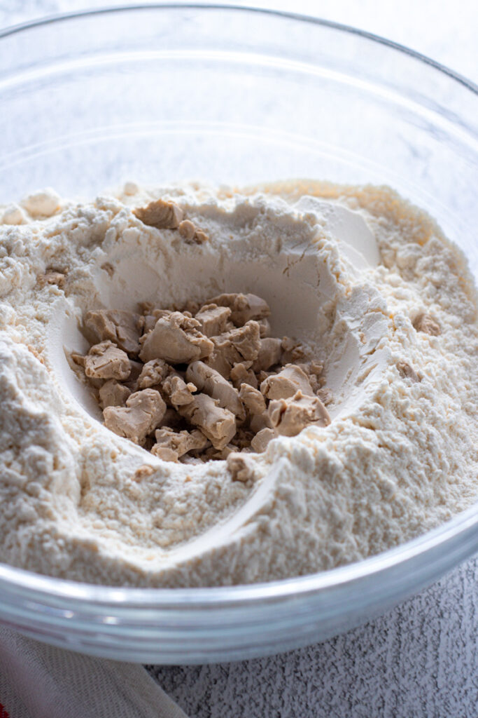 Fresh yeast in a flour well.