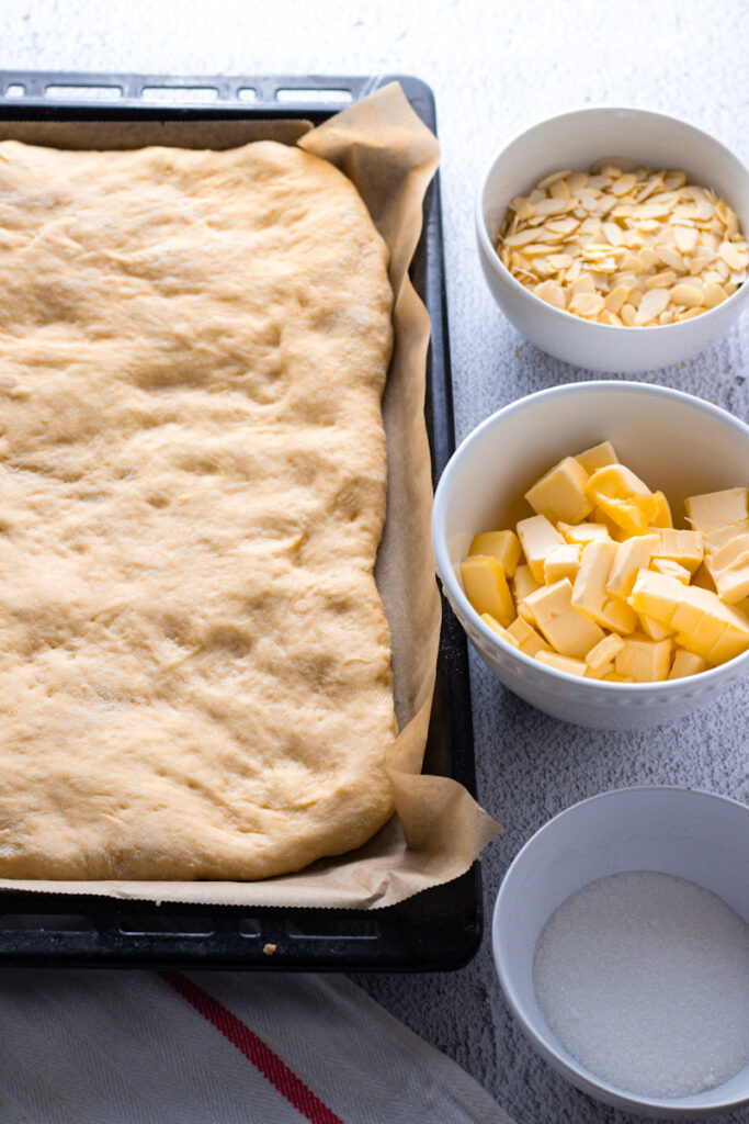 Dough for Butterkuchen with topping ingredients.