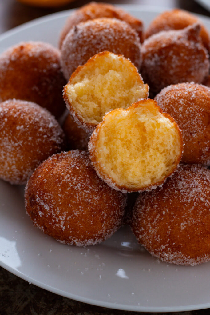 Close up of Donut holes showing fluffy interior.
