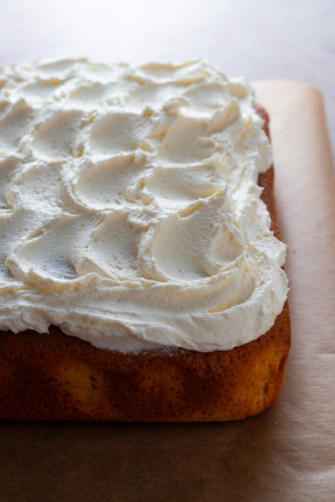 Vanilla Buttercream frosting on top of a vanilla cake.