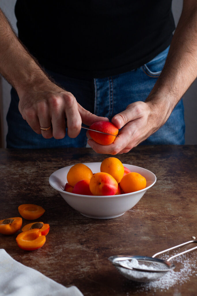 Jay cutting apricots.