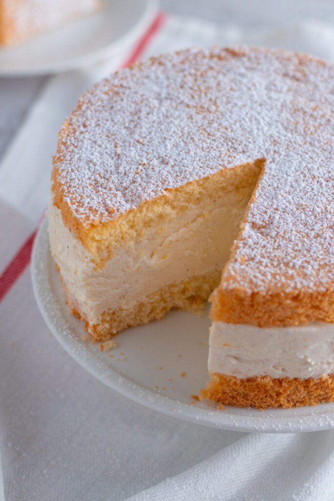 German Käse-Sahne Torte on a cake stand.