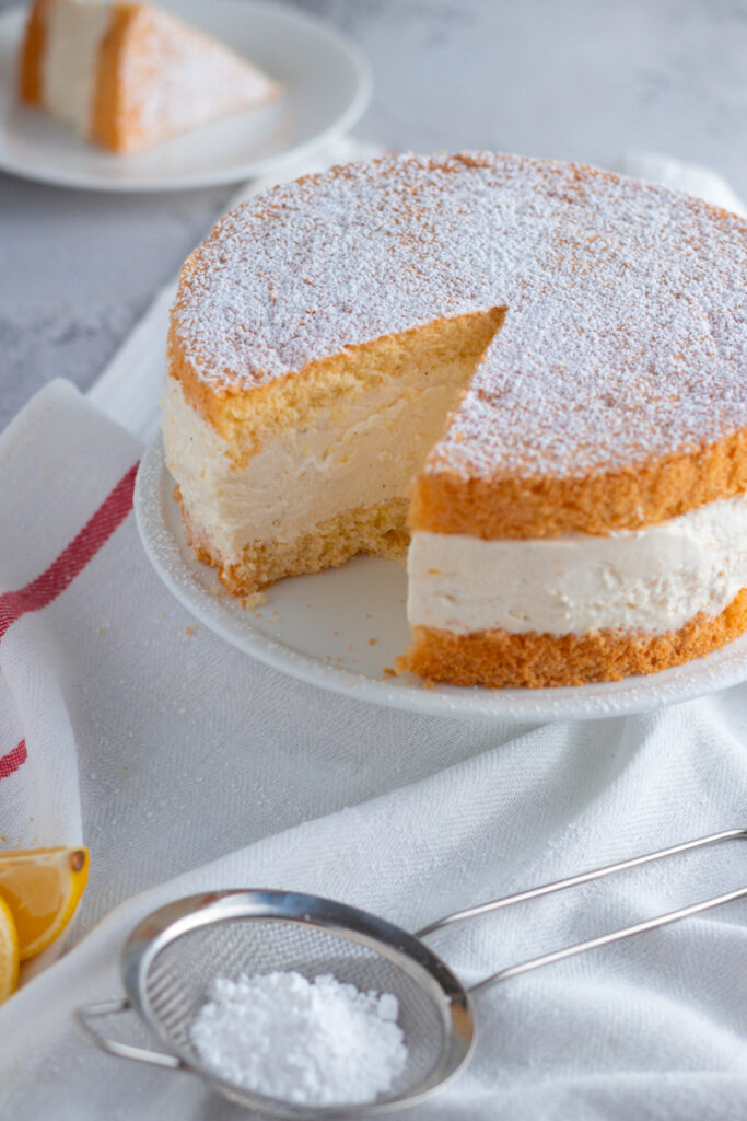 German Käse-Sahne Torte on a cake stand.