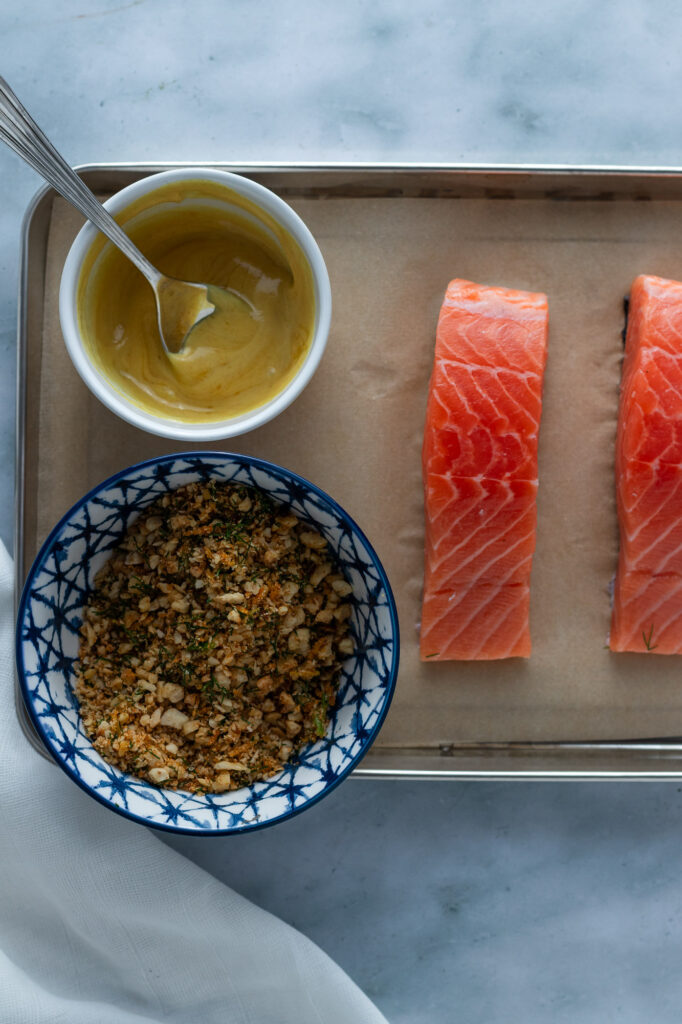 Salmon fillets ready to be crumbed.