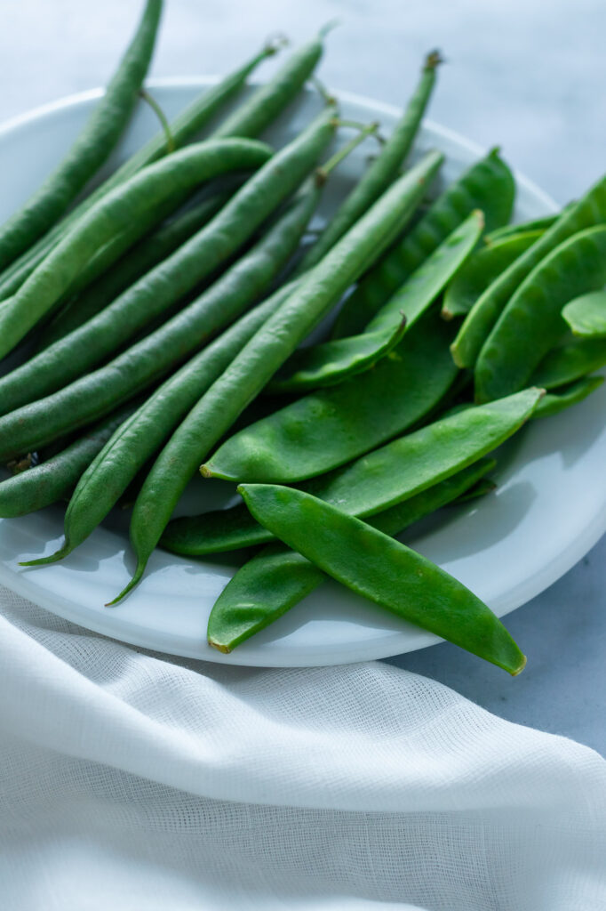 Beans and snow peas on a plate