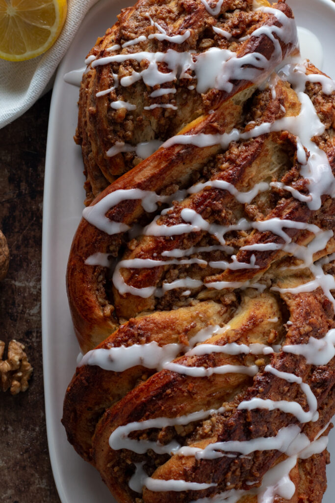 Braided baked walnut loaf close up.