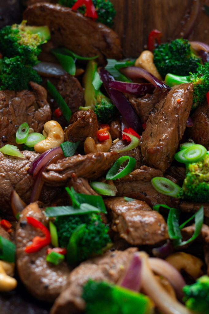 Close up of pork stir fry in a wok.