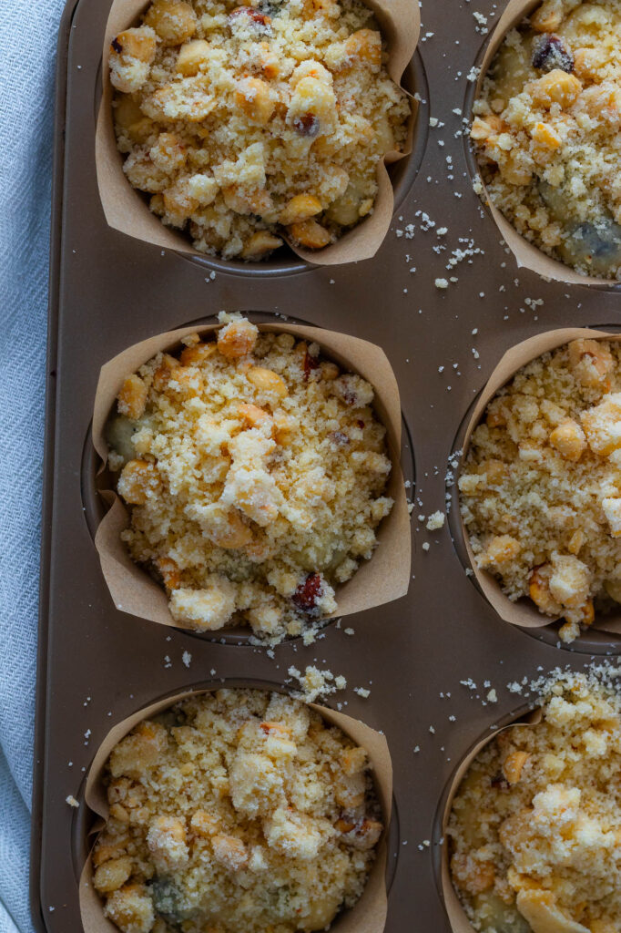 Unbaked blueberry muffins with streusel crumble topping.