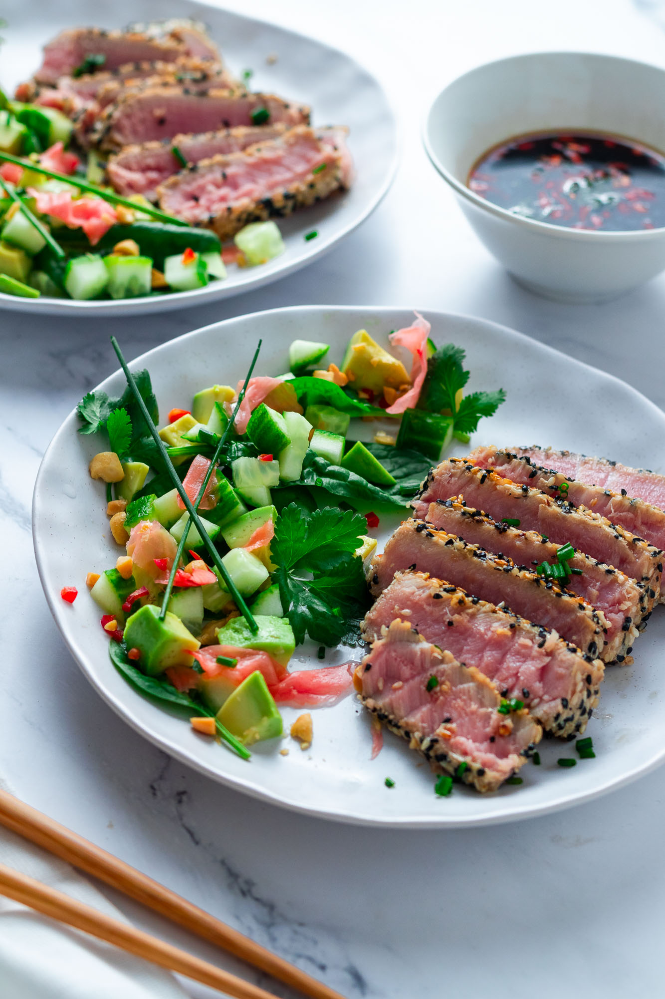 Sesame Crusted Tuna Tataki with asian style salad on a plate.