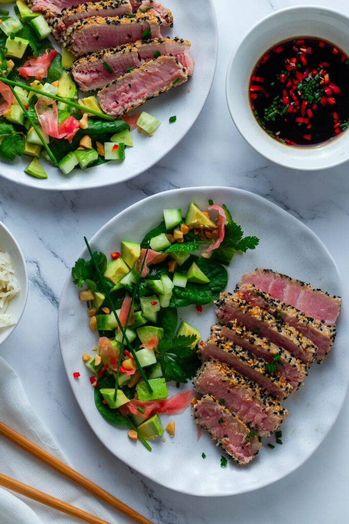 Sesame Crusted Tuna Tataki with asian style salad on a plate.