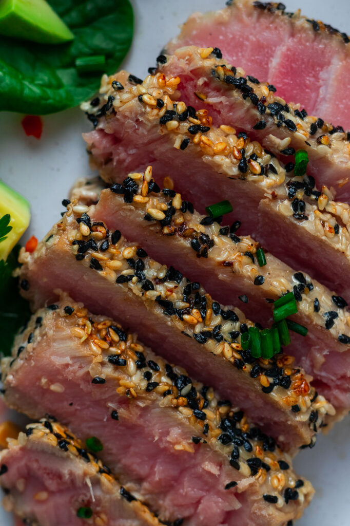 Sesame Crusted Tuna Tataki with asian style salad on a plate.