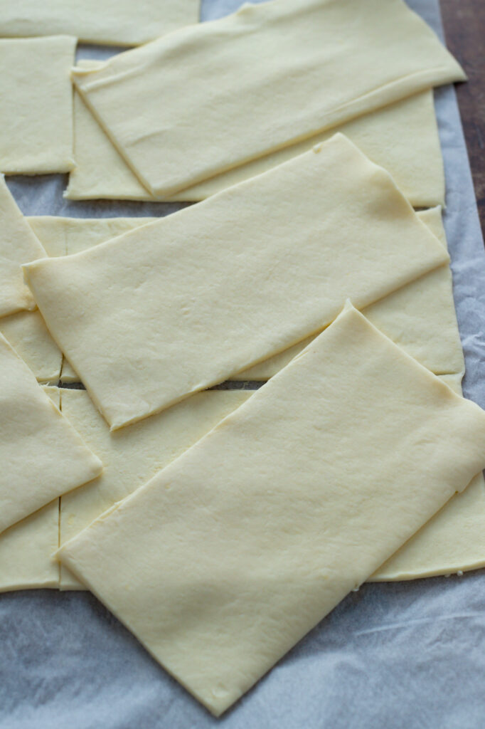 Pastry cut up for asparagus tarts.