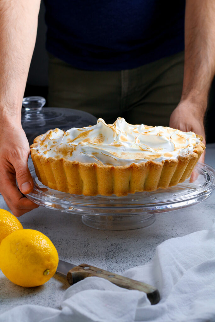 Jay holding a perfect lemon meringue pie, fully baked.